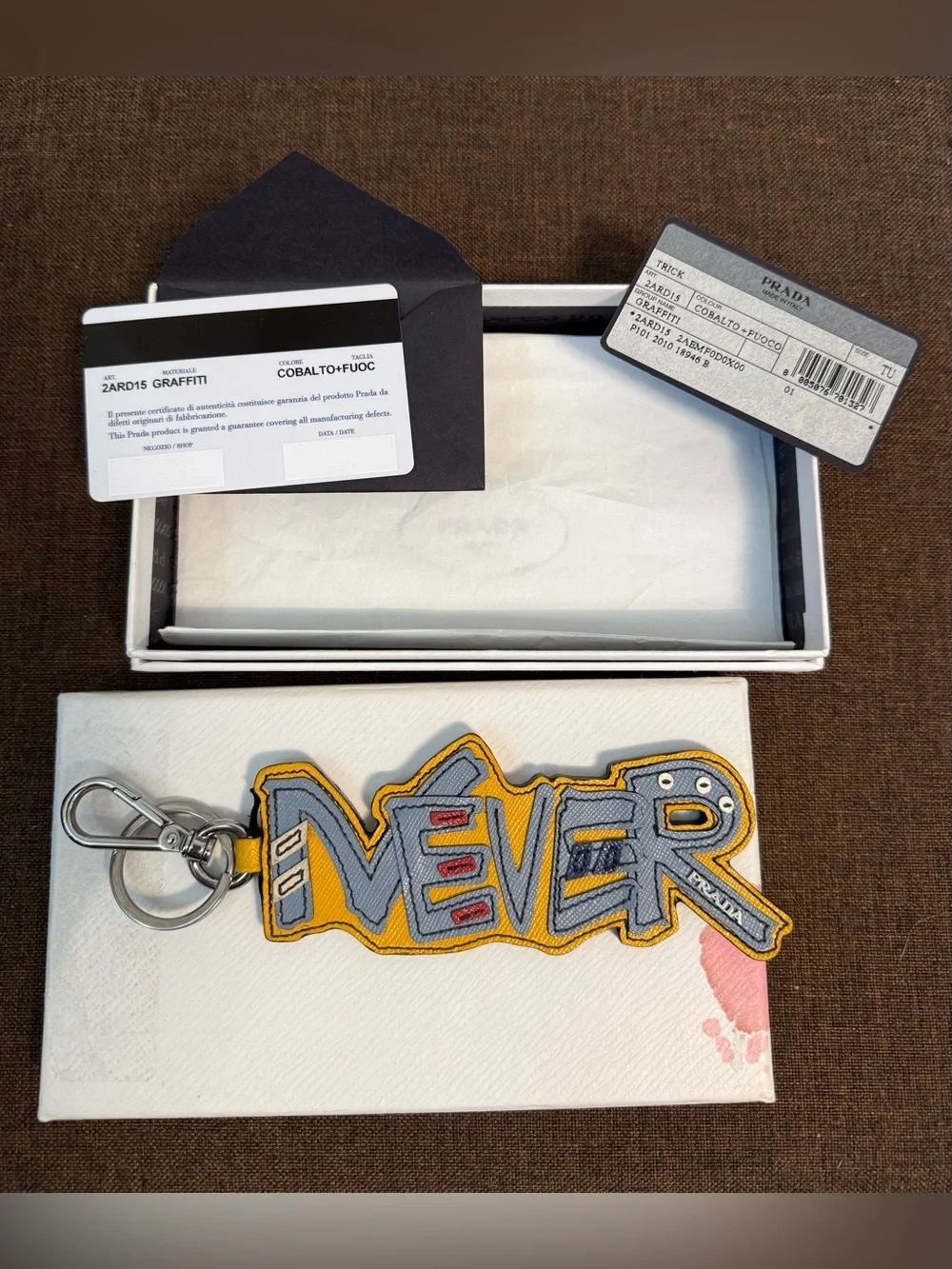 Authentic “NEVER” Prada Saffiano Leather Graffiti Keychain / Bag Charm with COA